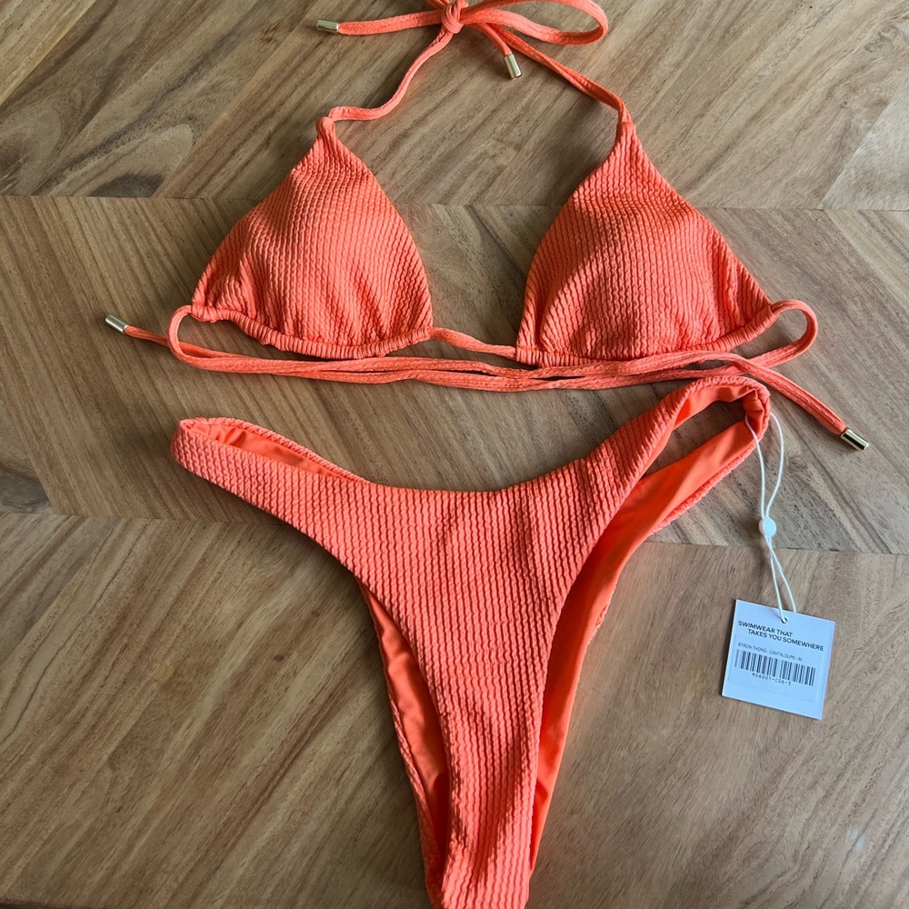 Monday swimwear bikini. Bought for my honeymoon worn once. No flaws!